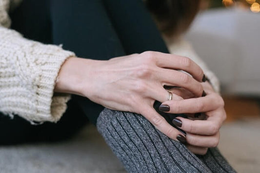 A woman spinning her anxiety fidget ring